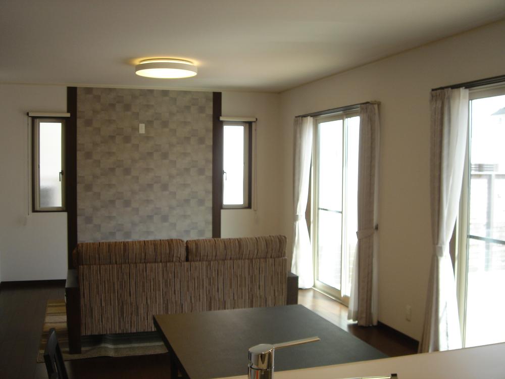 Living. Sunshine lit the living room from the south