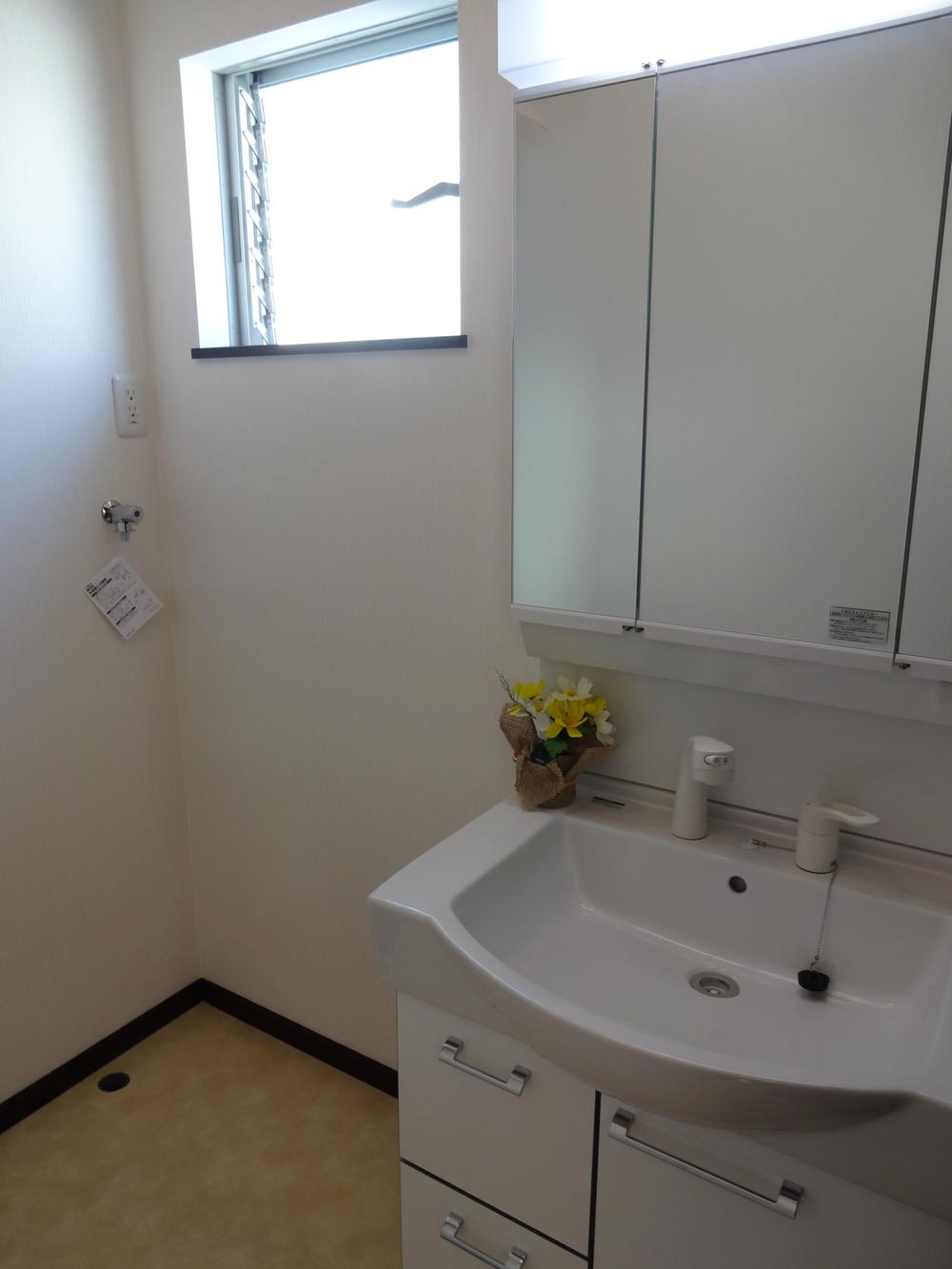 Wash basin, toilet. If there is a window is bright washroom. 