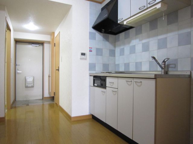 Living and room. Kitchen around is spread