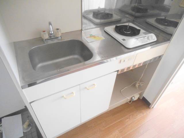 Kitchen. There is also a cooking space yet gas stove