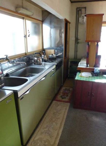 Kitchen. Bright kitchen and a cupboard behind