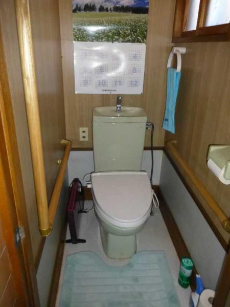 Toilet. Restroom handrail with