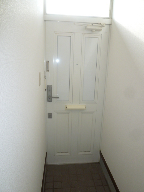 Other room space. Cute white entrance door
