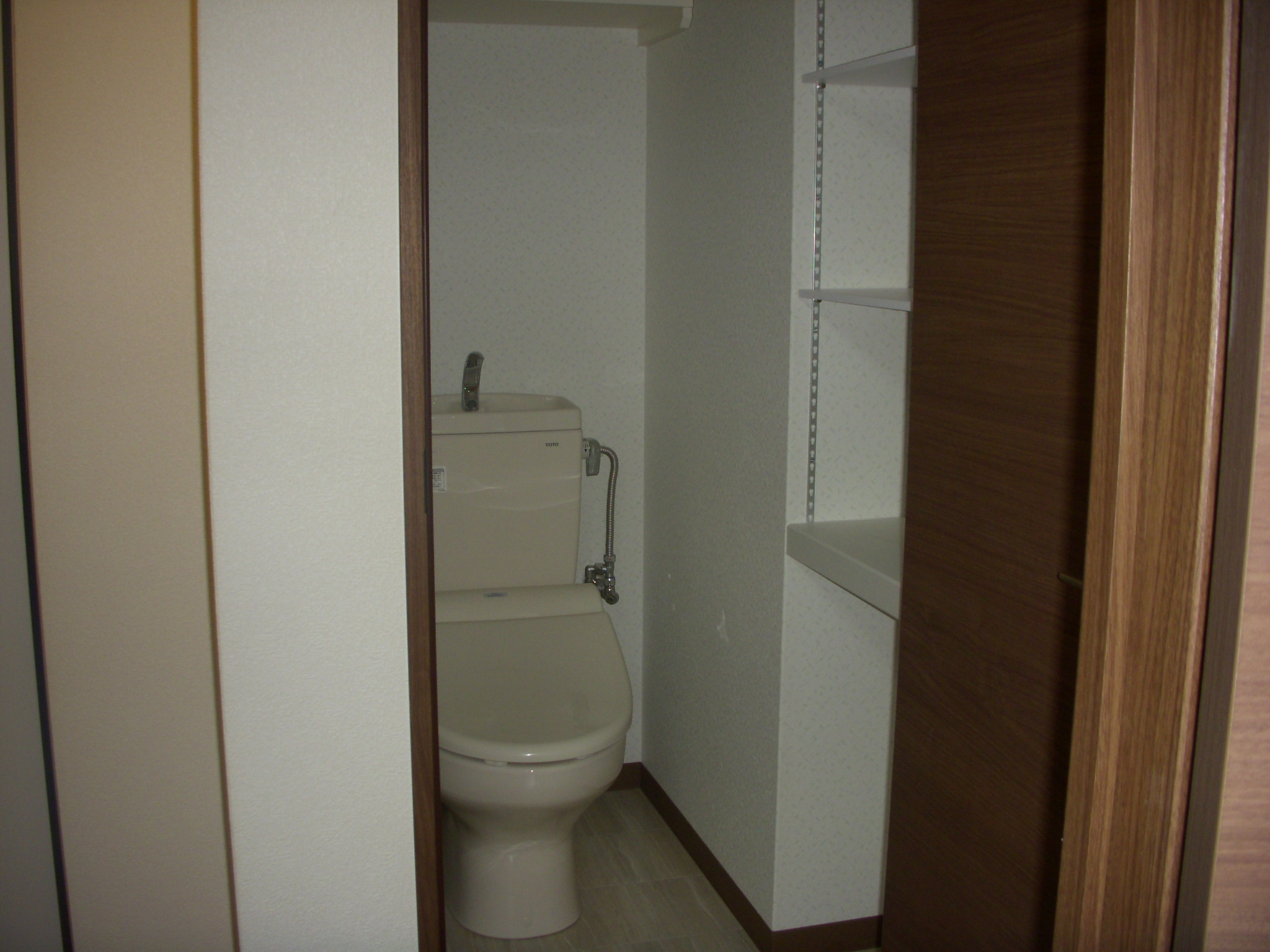 Toilet. It comes with storage shelves! 