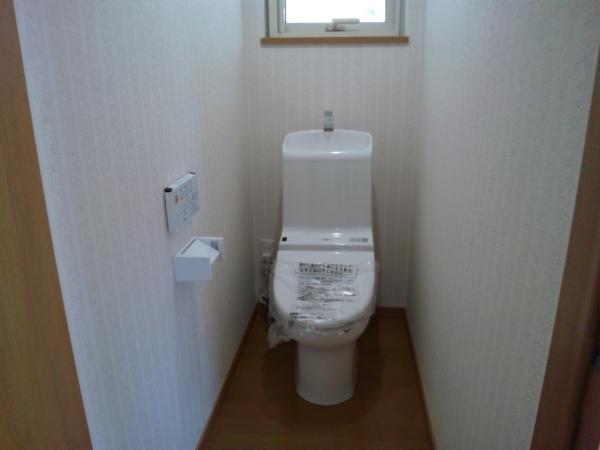 Toilet. Of course, it is washed with water. Cleaning function toilet seat new