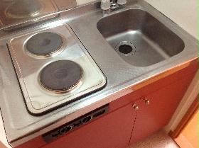 Kitchen. Easy to clean! Electric stove flat glass top does not go out of the fire