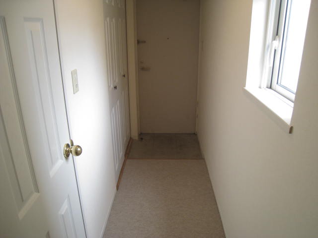 Entrance. It is in the hallway with a storage and a window! 