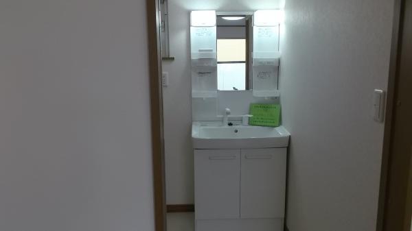 Wash basin, toilet. Wash basin is equipped with shower. 
