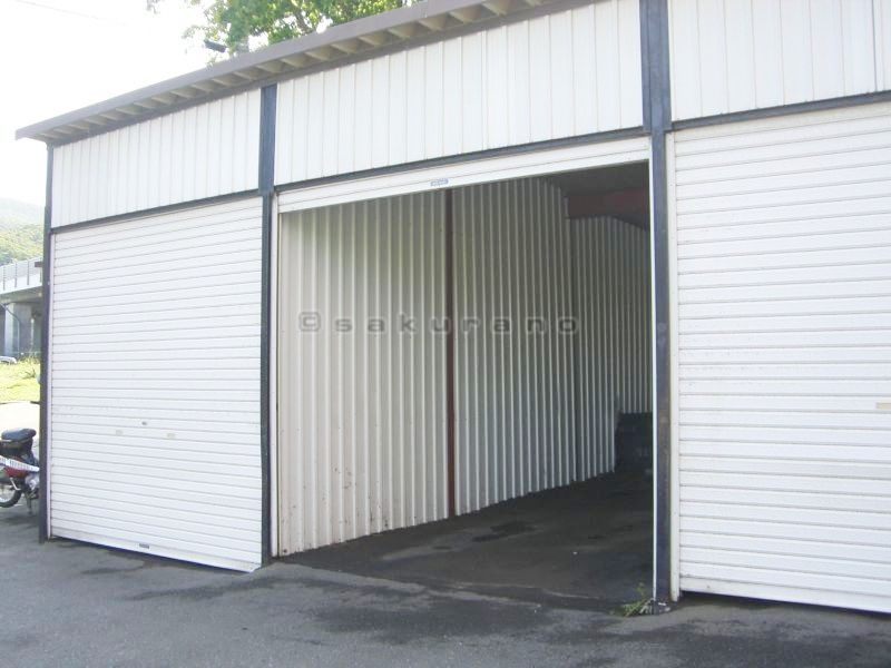 Parking lot. Large garage with shutter