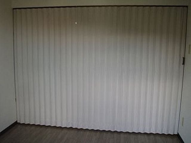 Other room space. Accordion curtain