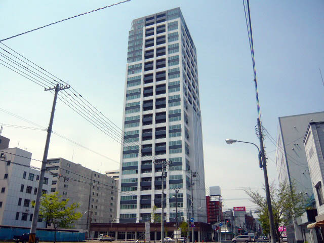 Building appearance. Tower apartment tower in the center