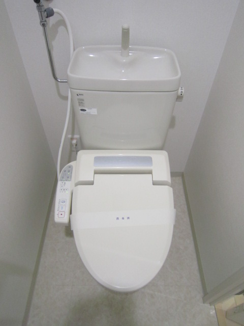 Toilet. It is a warm water washing heating toilet seat. 