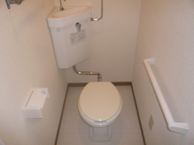 Toilet. It is a photograph of the toilet