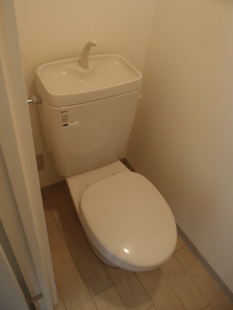 Toilet. Toilet is also decorated with a simple and clean. 