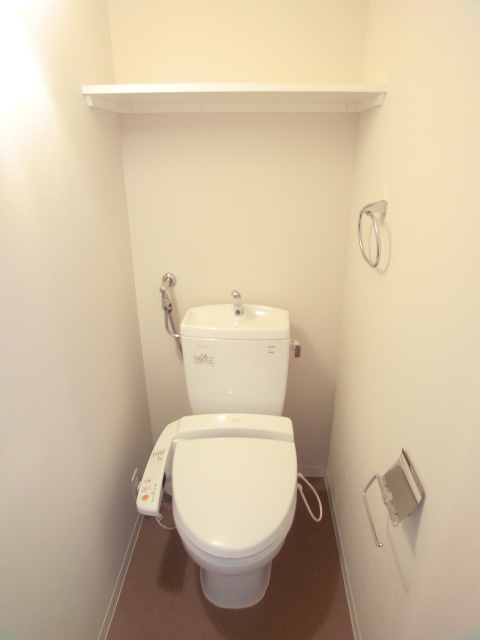 Toilet. With happy storage rack, It is with Washlet