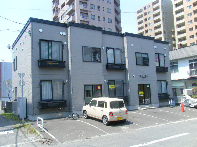 Building appearance. Parking is a blue sky