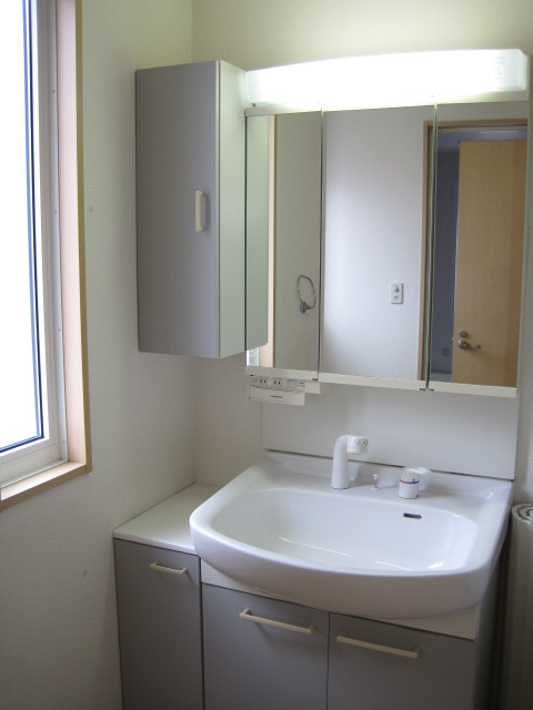 Washroom. Spacious with shampoo dresser in the window with a washroom! Busy morning worry