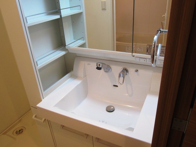 Washroom. Convenient with storage basin