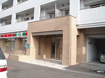 Building appearance. Convenience store on the first floor