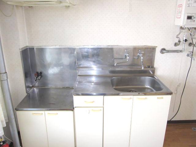 Kitchen. Two-burner stove also be easy to use put cutting board sink