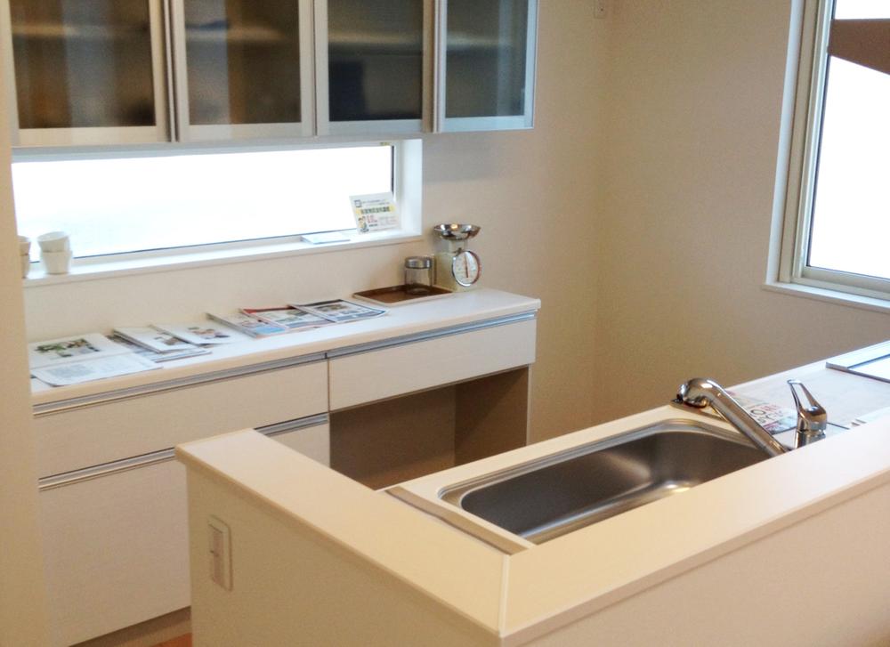 Kitchen. It provides a convenient cupboard for storage. Bright slit windows accented kitchen.