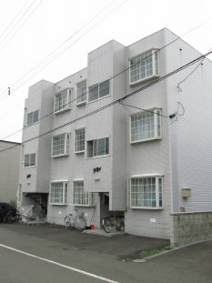 Building appearance. It is the white color of the building