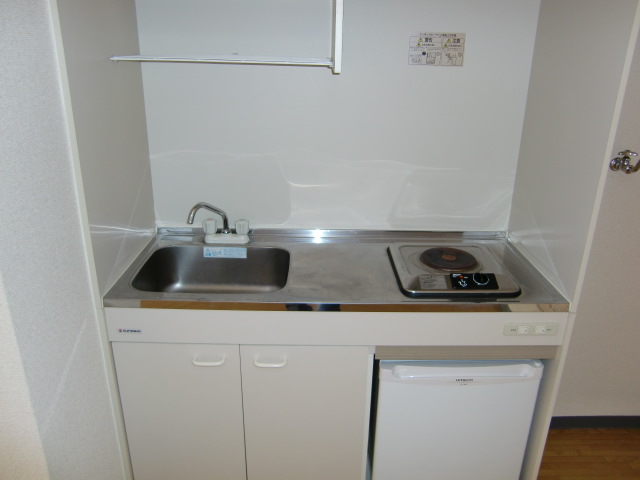 Kitchen. With stove and refrigerator! 