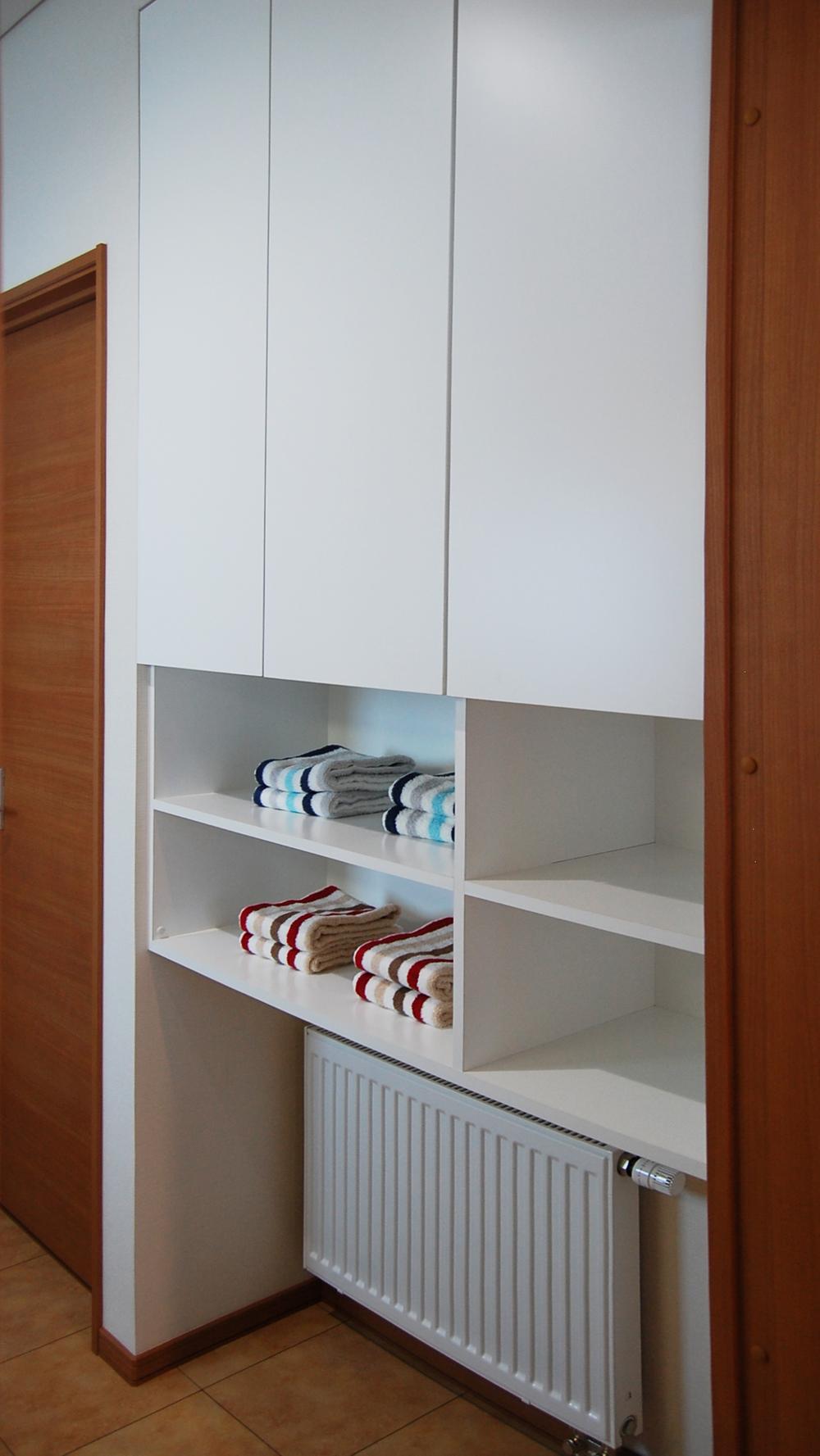 Wash basin, toilet. There is a happy housed in wash room.