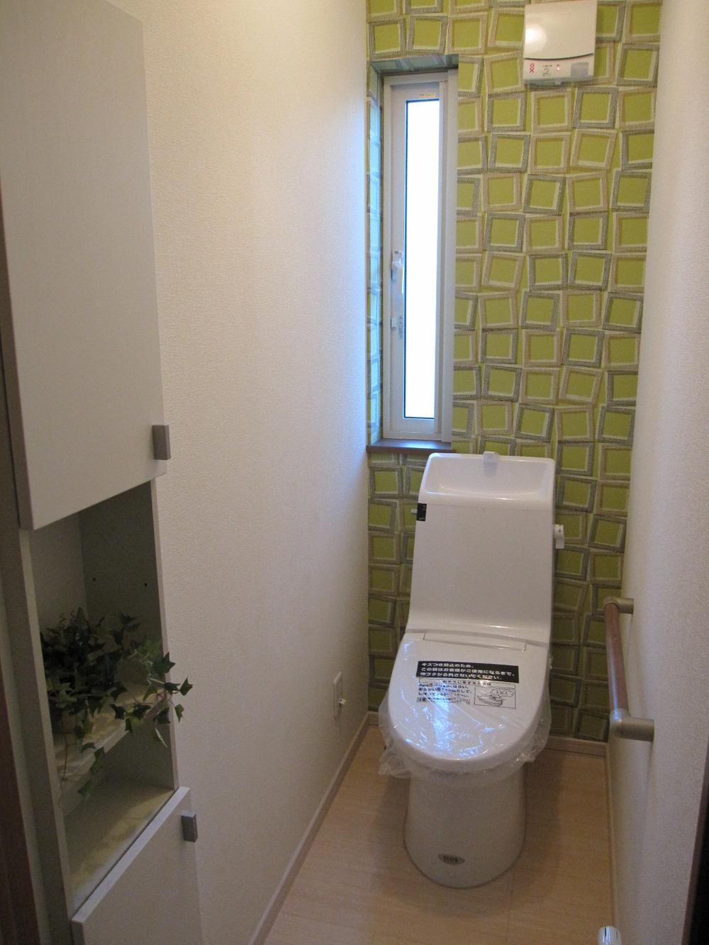 Toilet. There is a wall embedded storage, Very convenient for storage and not get in the way toilet paper