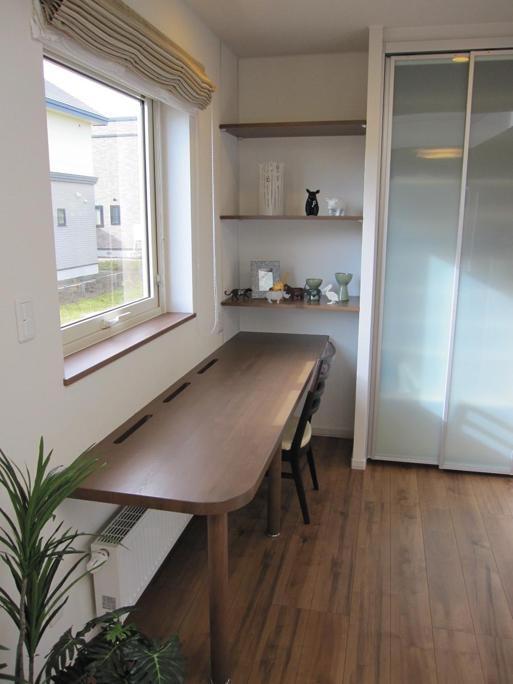 Other introspection. Housework corner with a counter desk with storage shelves in the kitchen
