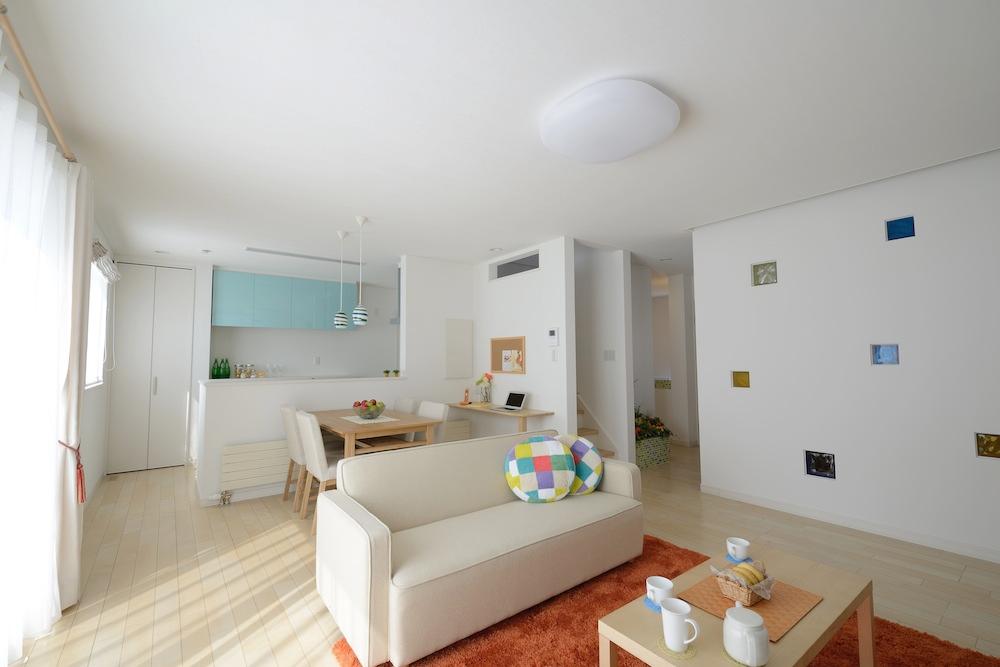 Living. The bright atmosphere using a POP of insert color to white was the keynote interior