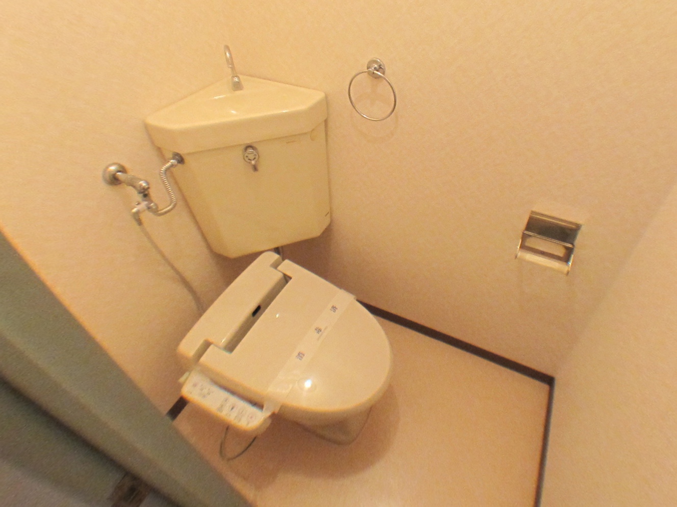 Toilet. It is a photograph of another in Room