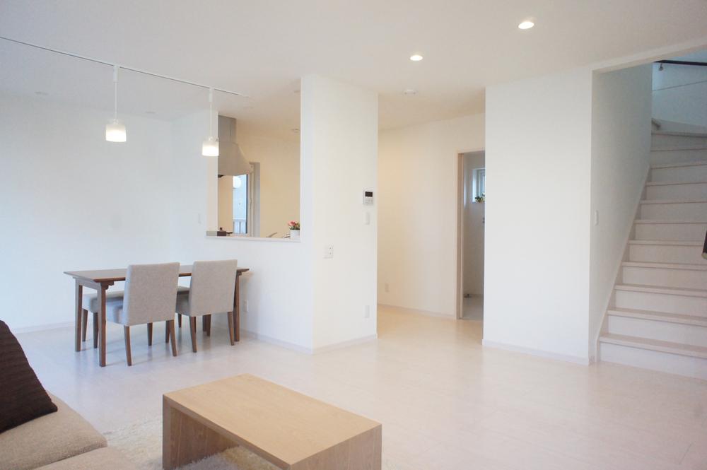 Living. Popular living staircase design to families with children. Wall portion of the stairs next to the storage compartment