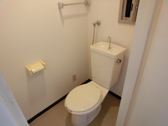 Toilet. It is a photograph of the same type by Room No.