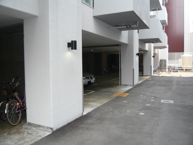 Parking lot. Parking of the car port type that will surpass the rain and wind! 