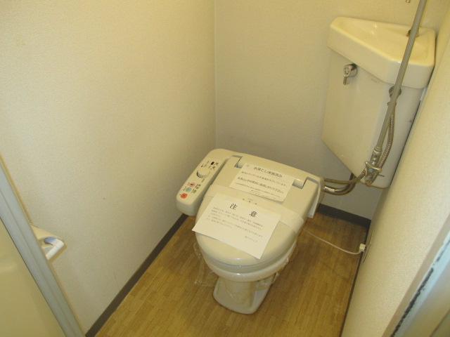 Toilet. It is a photograph of a different in Room