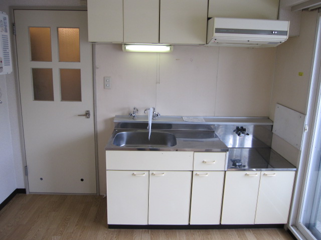 Kitchen. It is a photograph of a different in Room