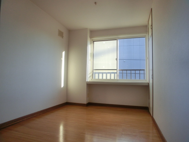 Other room space. Large windows is a bay window
