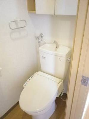 Toilet. Warm water washing toilet seat. Storage is also pat