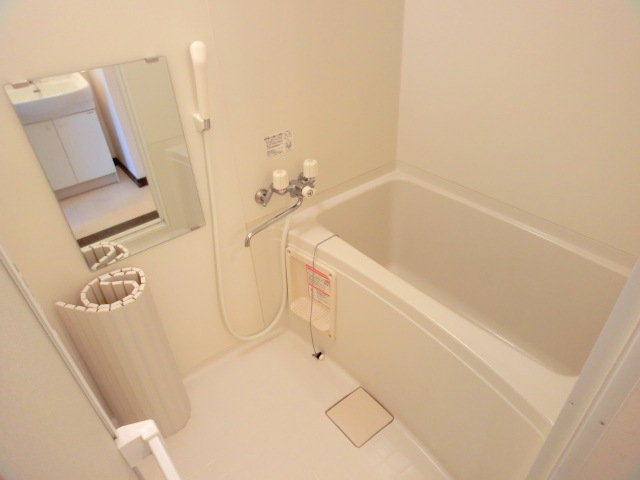 Bath. It is a spacious bathroom.