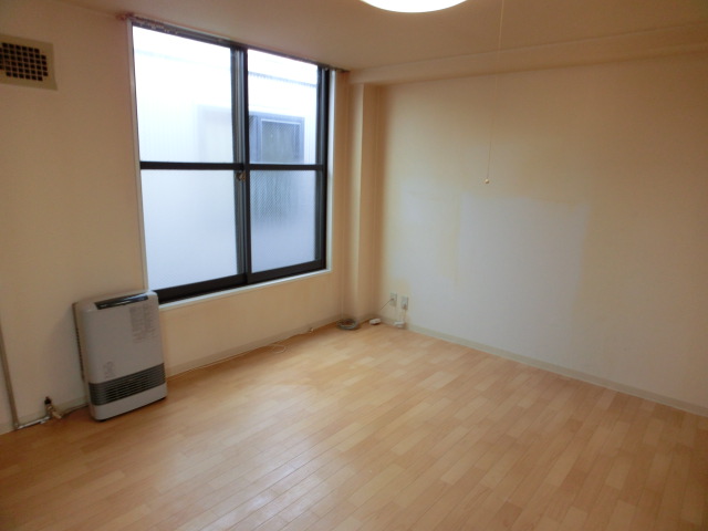 Other room space. It is bright and comes with a large window!
