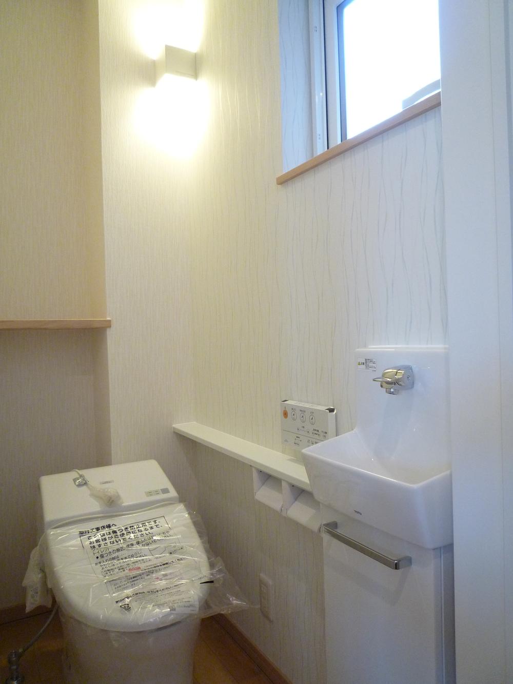 Toilet. With hand washing counter