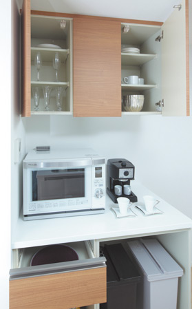 Kitchen.  [Cupboard] Adopt the same surface material and the kitchen. Counter of depth 65cm is convenient to place the household appliances. It has secured a space to put a dust box.