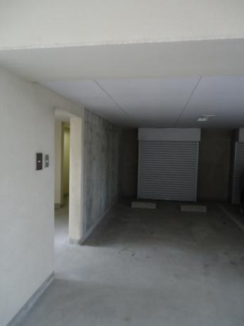 Parking lot. Indoor parking lot, There is a tire rack in the back.