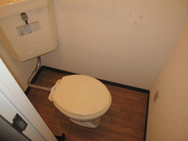 Toilet. With paper holder! 