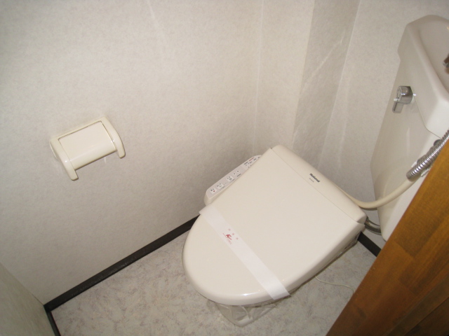 Toilet. Warm water washing toilet seat equipped