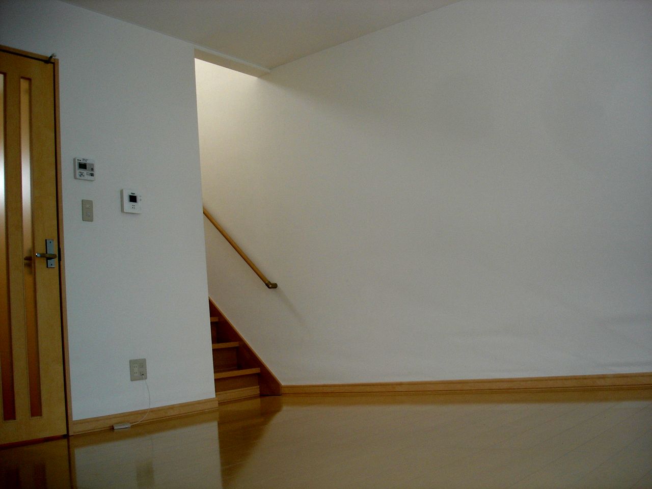 Living and room. It is to the second floor and use the stairs from the living room. 