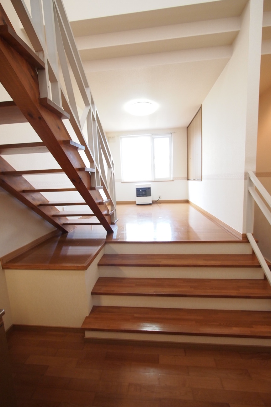 Kitchen. Is a staircase going up from the kitchen to the living room. 