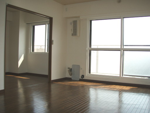 Living and room. Southwest-facing living room with balcony