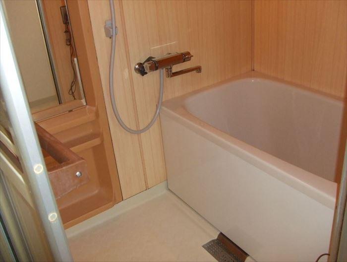 Bathroom. Spacious bath put slowly stretched out foot.